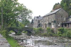 A double arched bridge, leading from the hamlet to grave